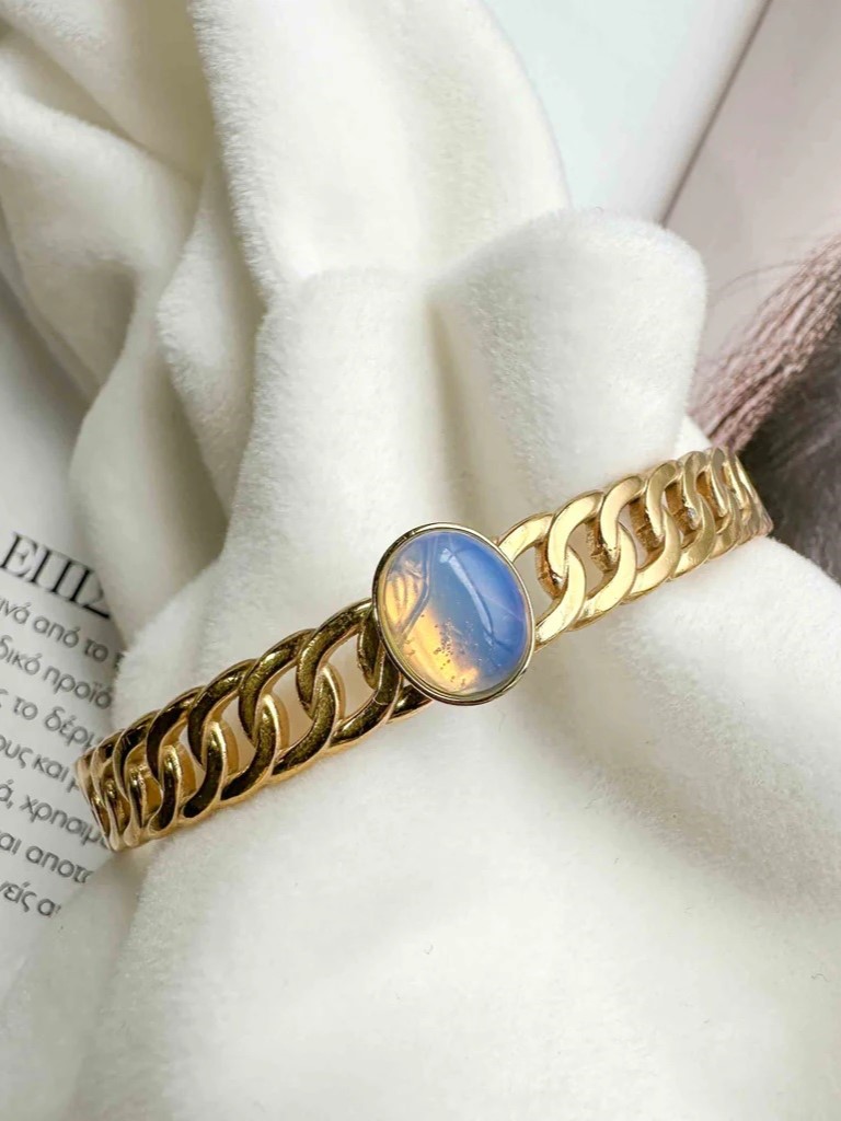 Handcuff bracelet with braiding of gold-plated steel and opal stone Golden Elephantina